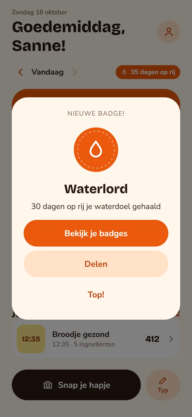 Schermafbeelding: felicitatie met een nieuwe badge, Waterlord: 30 dagen op rij je waterdoel gehaald